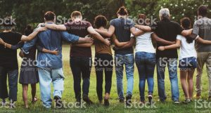 Diverse-Group-of-People-Huddled-Together